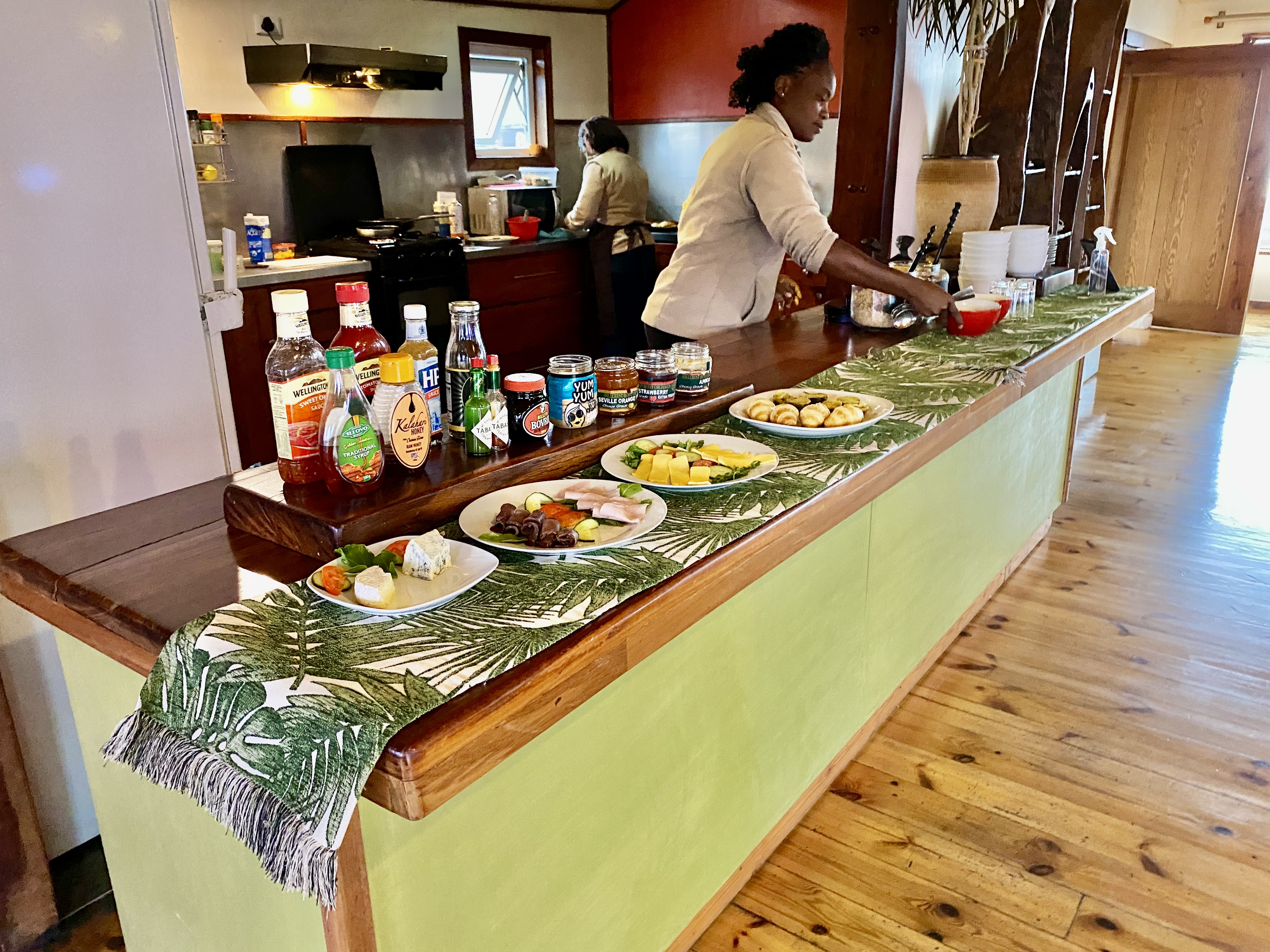 Breakfast buffet with cheeses, cold meats and pastries being prepared at The Stiltz