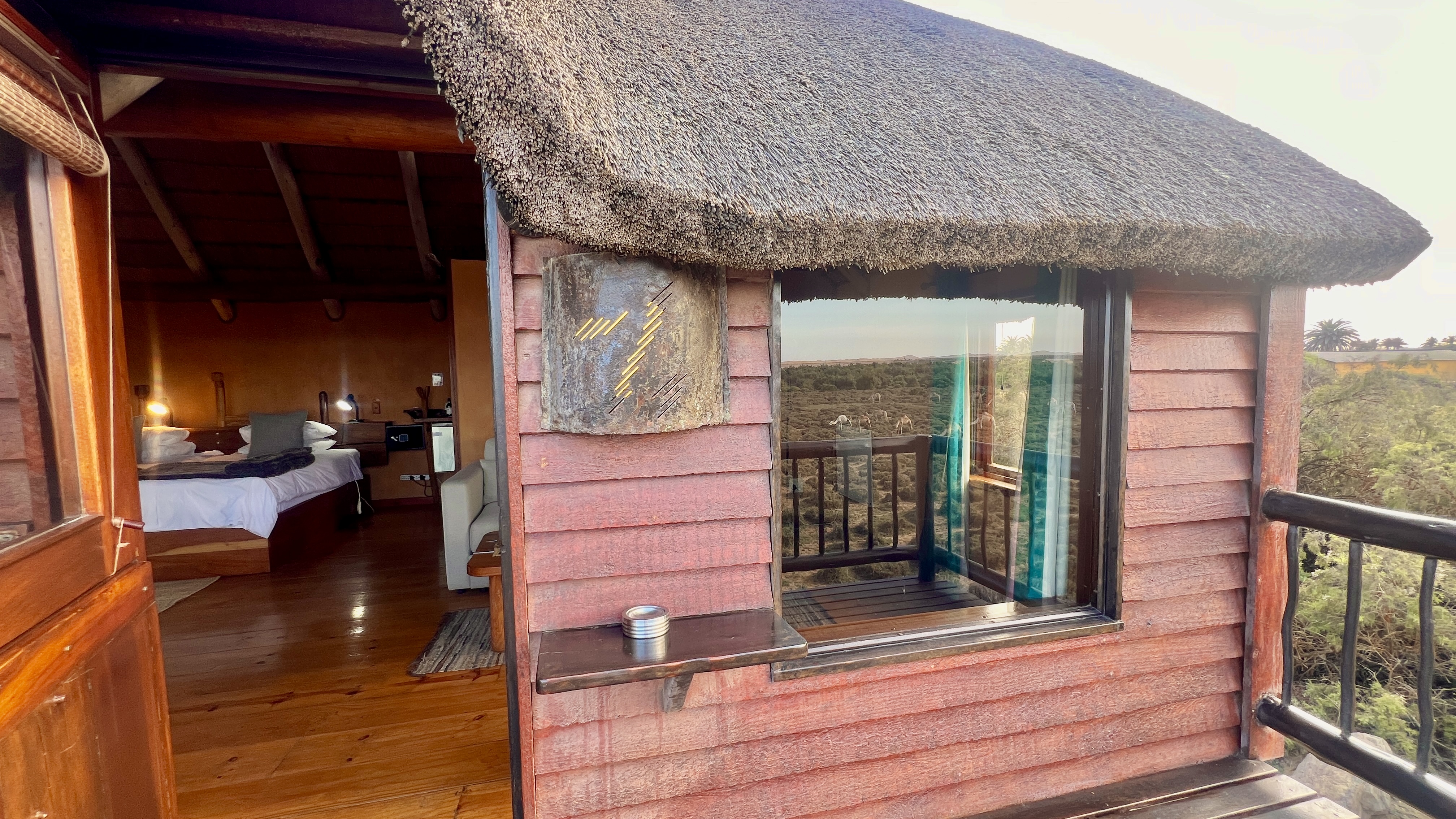 Timber Lagoon Bungalow exterior with an open doorway into the bedroom