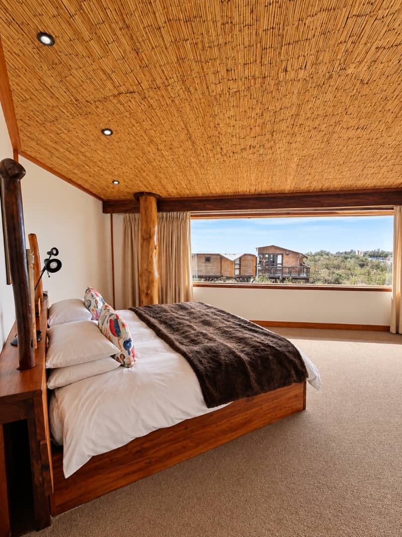 Villa double bedroom beneath a woven ceiling