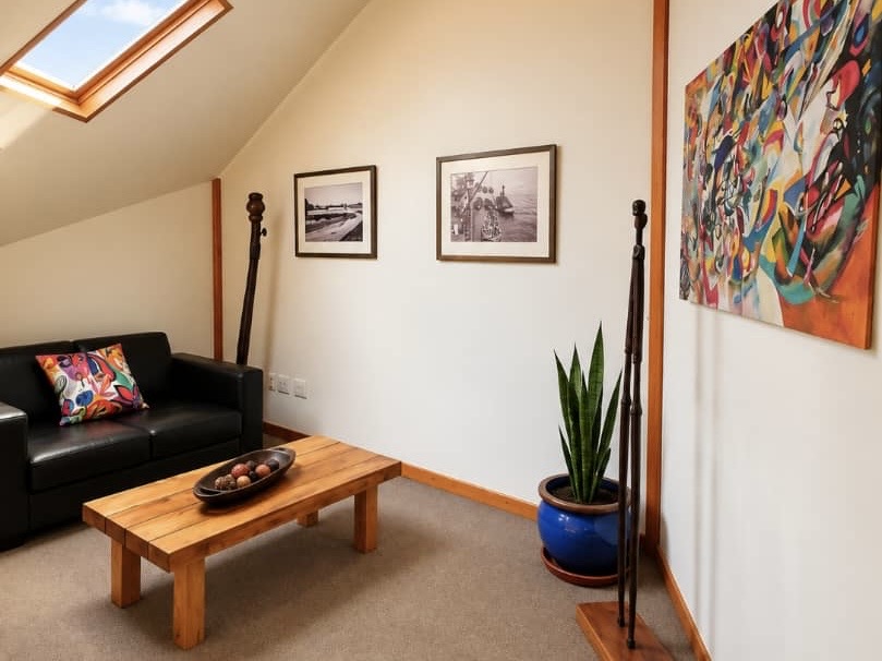Villa lounge with artwork and a timber coffee table