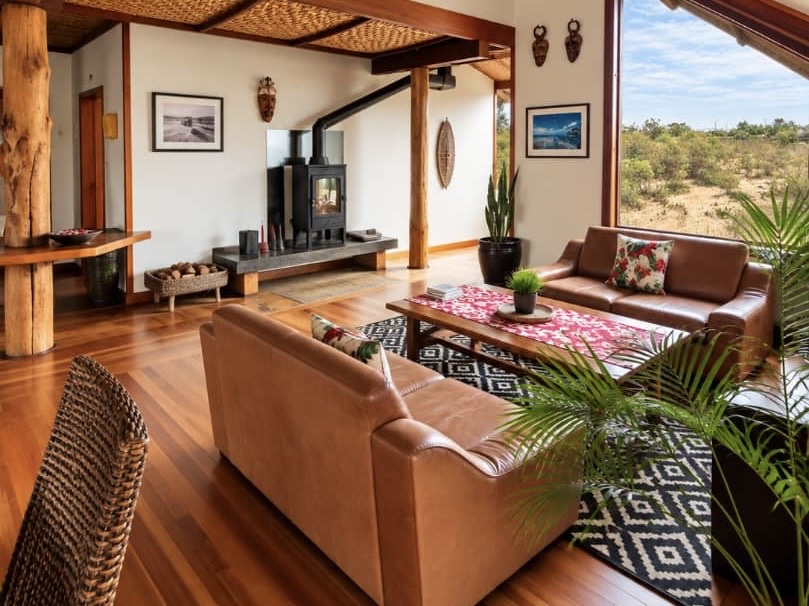 Open-plan Villa living area with leather sofas and timber finishes