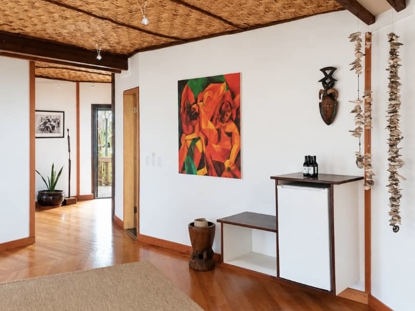 Villa hallway with colourful artwork and timber details